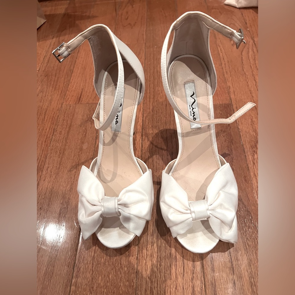 White satin stiletto heel with large white satin bow